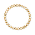 Gouden elastische kralenarmband van gold filled 14K met 6mm kralen, van Bedels & Bedels.