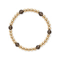 Gouden kralenarmband van gold filled 14K met 5mm kralen en gefacetteerde rookkwarts edelstenen, van Bedels & Bedels.