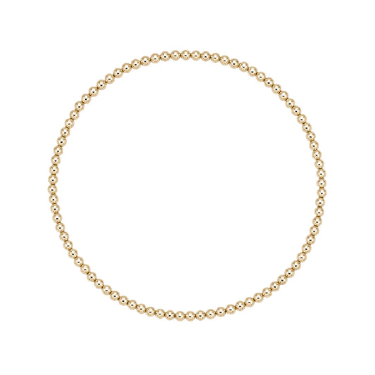Gouden elastische kralenarmband van gold filled 14K met 2mm kralen, van Bedels & Bedels.