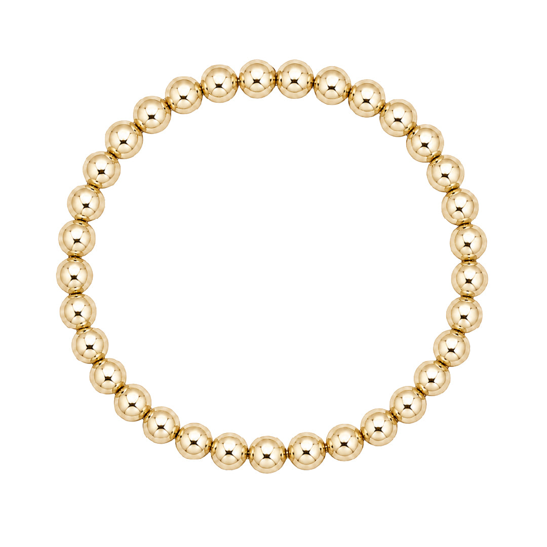 Gouden elastische kralenarmband van gold filled 14K met 5mm kralen, van Bedels & Bedels.