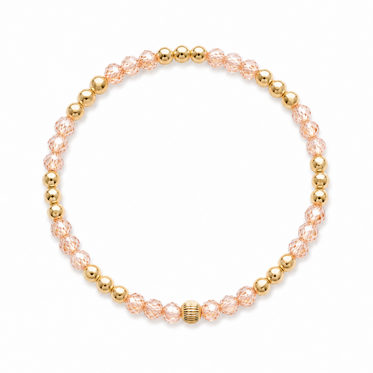 Gold filled armband met champagne zirkonia en gouden kralen op witte achtergrond