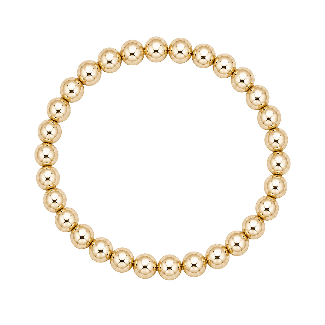 Gouden elastische kralenarmband van gold filled 14K met 6mm kralen, van Bedels & Bedels.