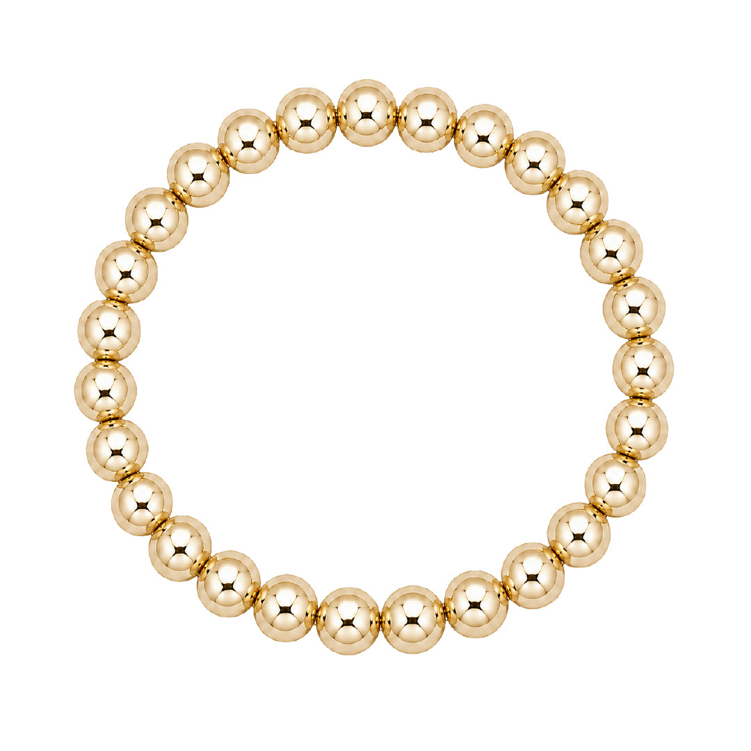 Gouden elastische kralenarmband van gold filled 14K met 7mm kralen, van Bedels & Bedels.