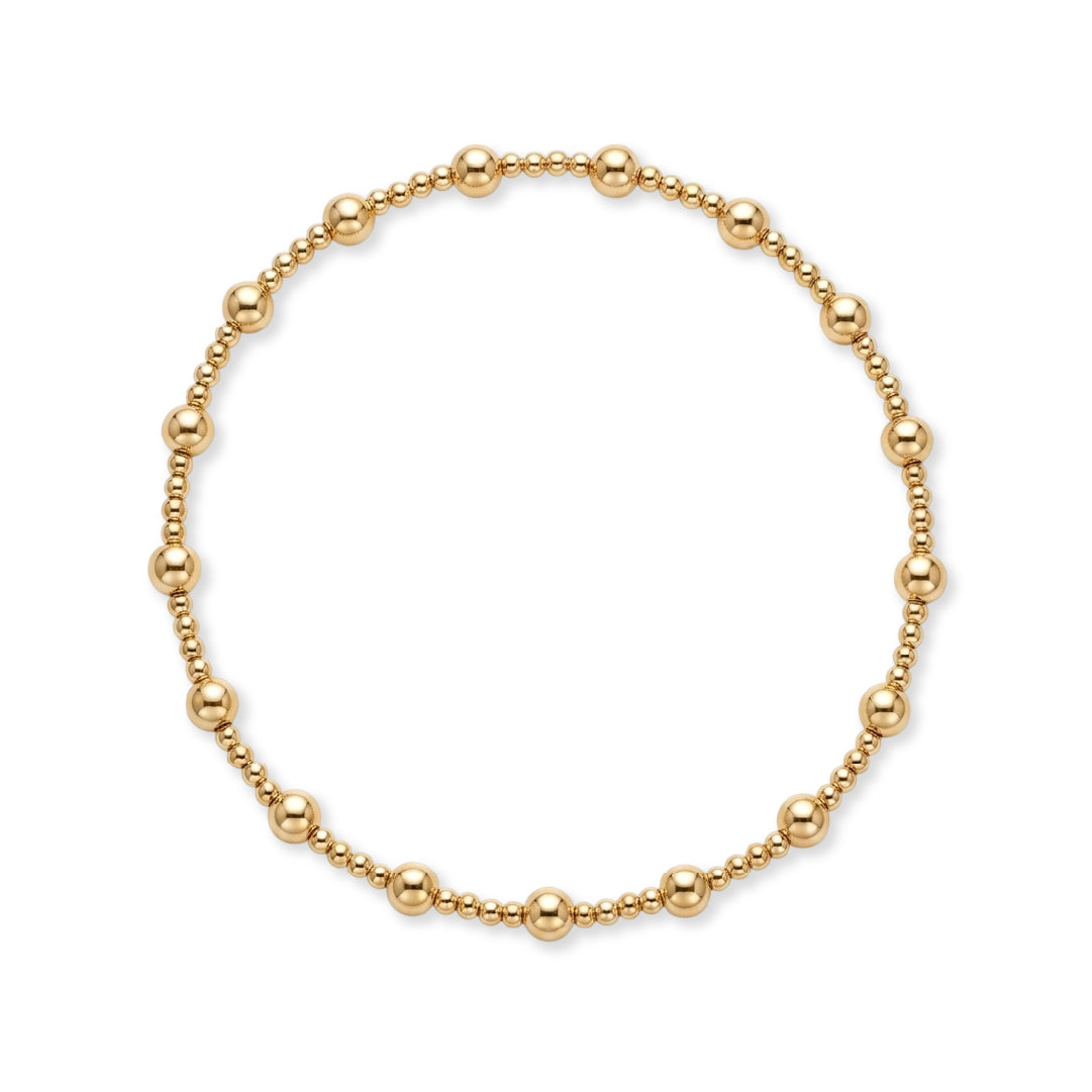 Gouden kralenarmband van gold filled 14K met 4mm kralen en groepjes fijne 2mm kraaltjes, van Bedels & Bedels.
