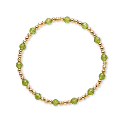 Gouden armband van gold filled 14K ritmisch afgewisseld met groene peridoot edelstenen, van Bedels & Bedels.