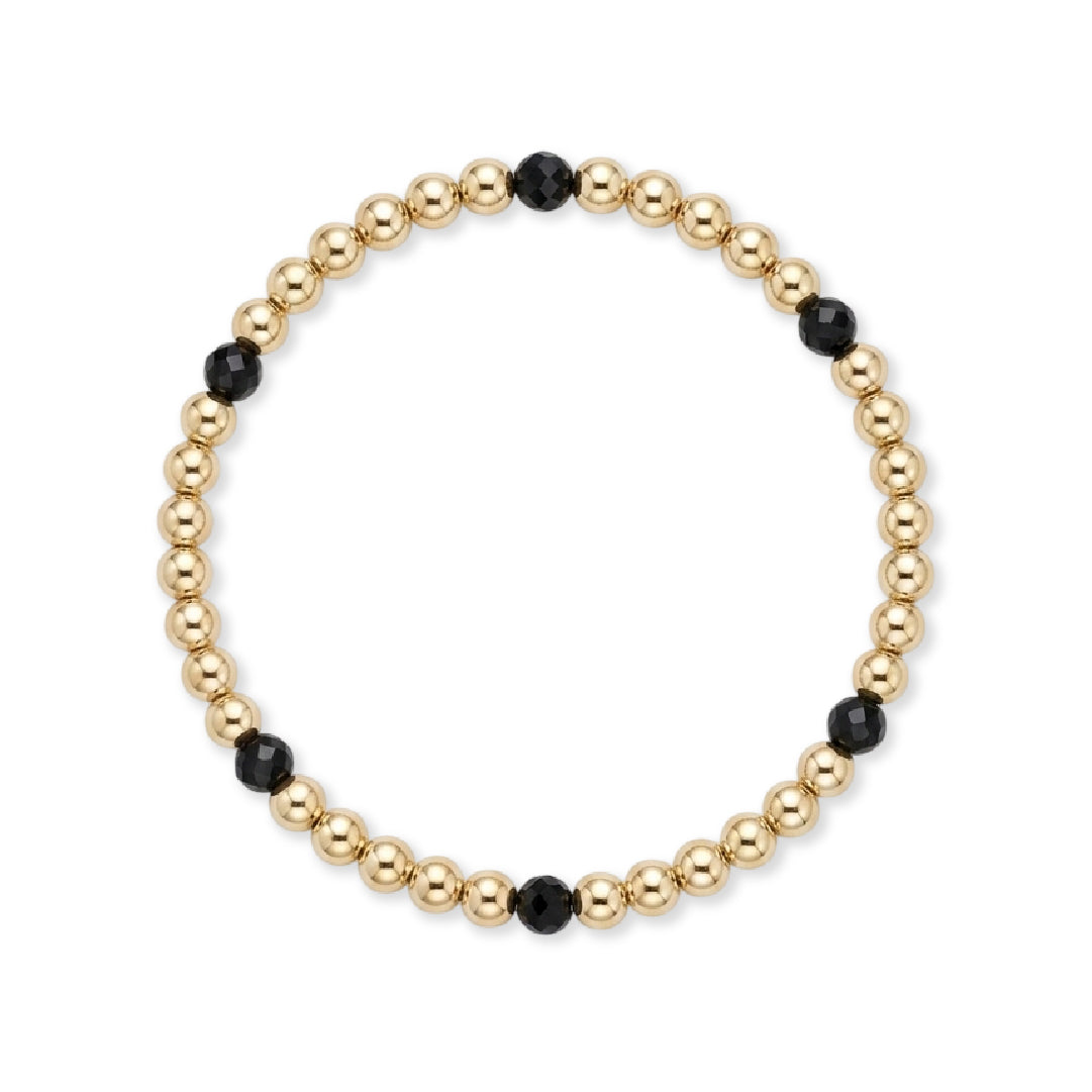 Gouden kralenarmband van gold filled 14K met 4mm zwarte spinel edelstenen, van Bedels & Bedels.