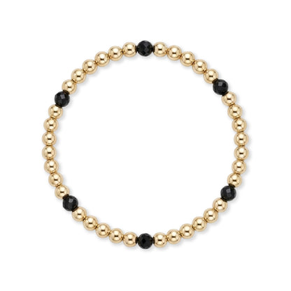 Gouden kralenarmband van gold filled 14K met 4mm zwarte spinel edelstenen, van Bedels & Bedels.