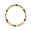 Gouden kralenarmband van gold filled 14K met 6mm kralen en rookkwarts edelstenen, van Bedels & Bedels.