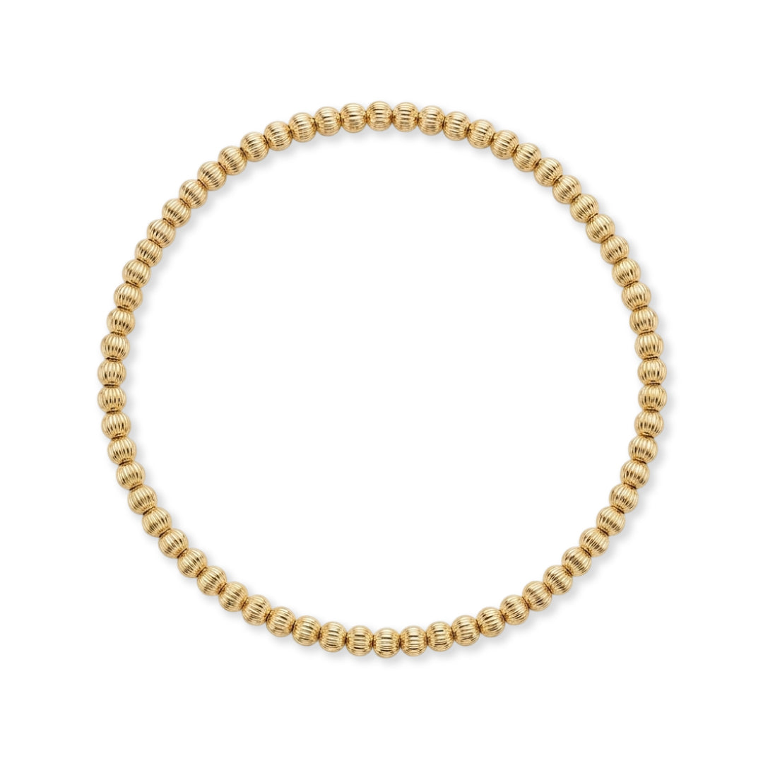 Gouden armband van gold filled 14K met geribbelde kralen van 3mm, van Bedels & Bedels.
