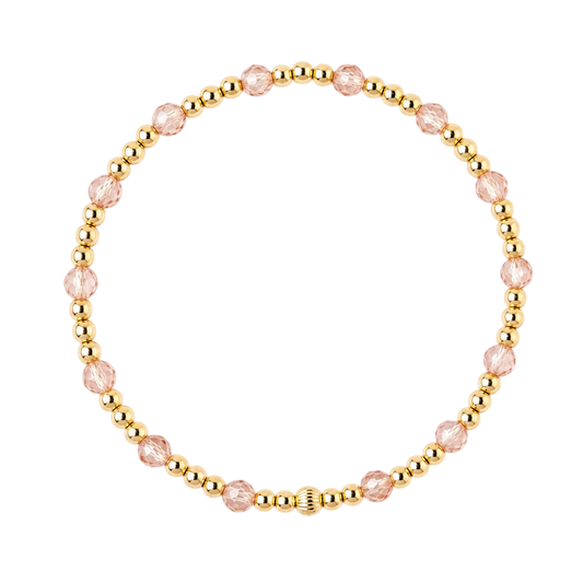 Gouden armband met gold filled kralen en champagnekleurige zirkonia steentjes op witte achtergrond