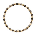 Gold filled armband van Bedels & Bedels met rookkwarts en gouden kralen van 4mm op witte achtergrond
