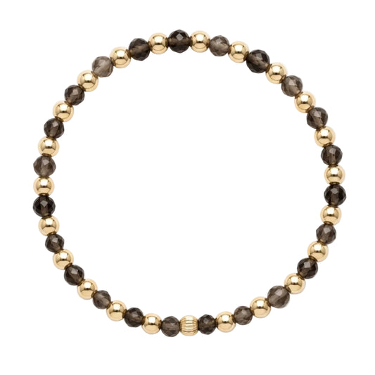 Gold filled armband van Bedels & Bedels met rookkwarts en gouden kralen van 4mm op witte achtergrond