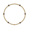 Fijne gouden kralenarmband van gold filled 14K met kleine gefacetteerde rookkwarts edelstenen, van Bedels & Bedels.