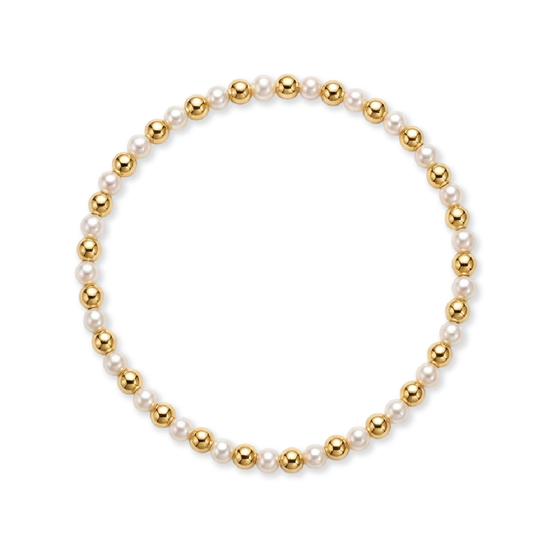 Gouden parelarmband van gold filled 14K met om en om 4mm gouden kralen en witte zoetwaterparels, van Bedels & Bedels.
