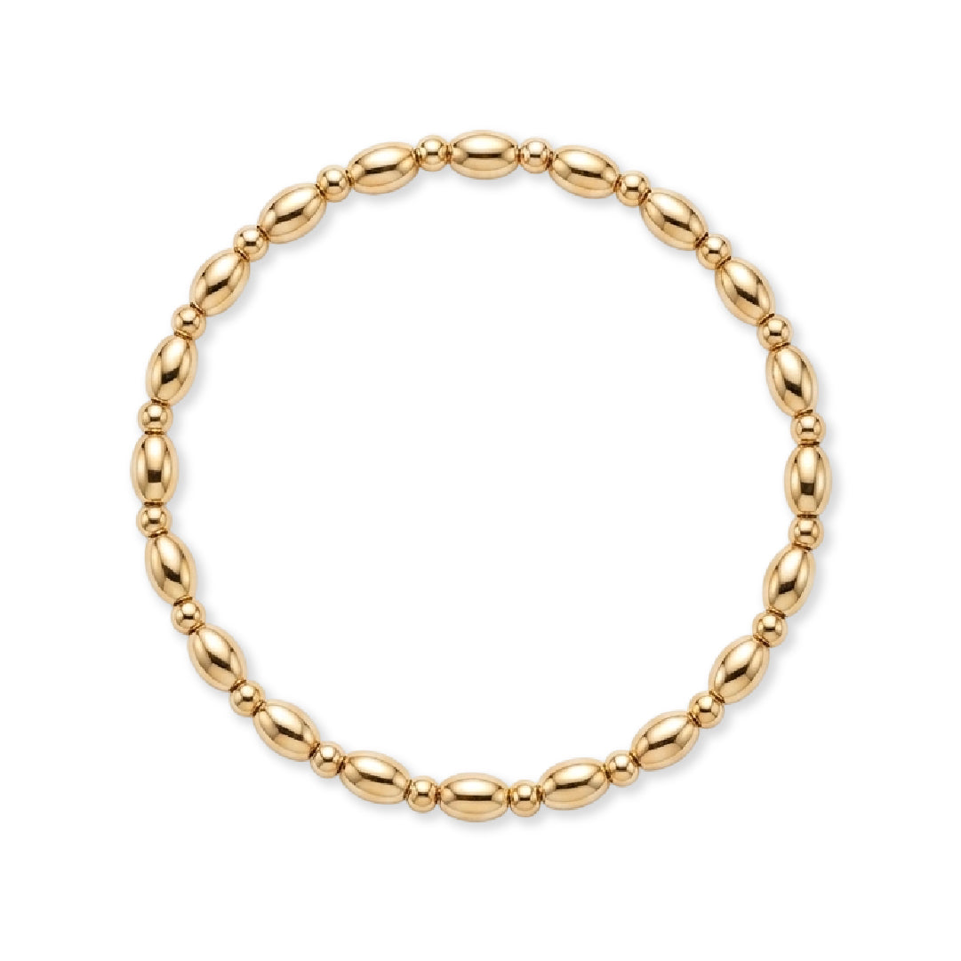 Gouden armband van gold filled 14K met ovale kralen en fijne tussenkraaltjes, van Bedels & Bedels.