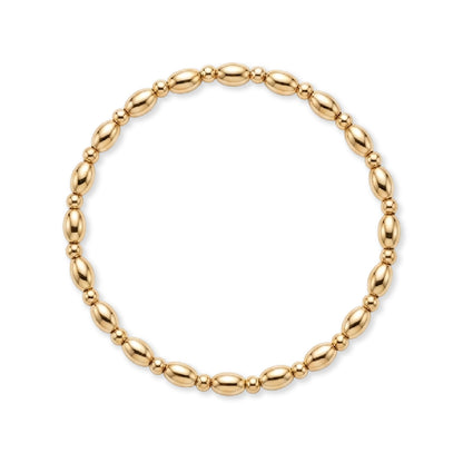 Gouden armband van gold filled 14K met ovale kralen en fijne tussenkraaltjes, van Bedels & Bedels.