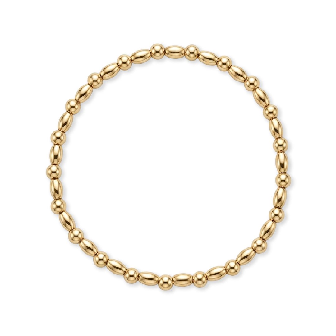 Gouden armband van gold filled 14K met ovale kralen en dubbele bolkralen, van Bedels & Bedels.