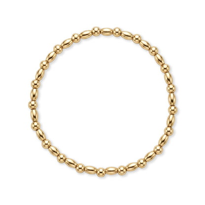 Gouden armband van gold filled 14K met ovale kralen en dubbele bolkralen, van Bedels & Bedels.